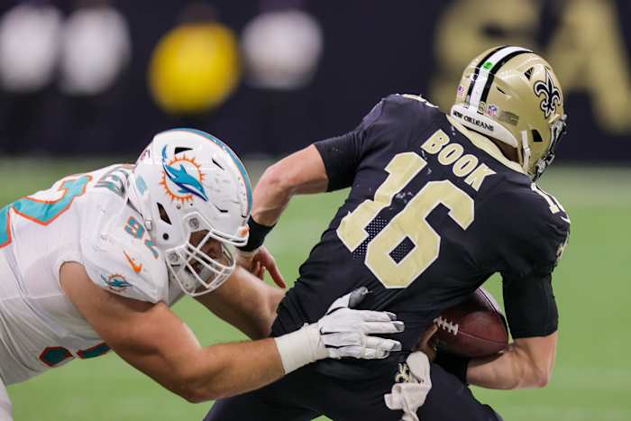 Miami defensive end Zach Sieler (92) sacks New Orleans Saints quarterback Ian Book (16). Mandatory Credit: Stephen Lew-USA TODAY Sports